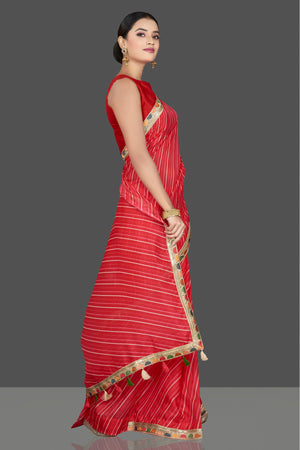 Shop gorgeous red Kota saree online in USA with lace border. Be the center of attraction on special occasion in beautiful designer sarees, handloom sarees, Kota silk sarees, Banarasi saris, Kanchipuram silk sarees from Pure Elegance Indian saree store in USA.-side