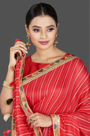Shop gorgeous red Kota saree online in USA with lace border. Be the center of attraction on special occasion in beautiful designer sarees, handloom sarees, Kota silk sarees, Banarasi saris, Kanchipuram silk sarees from Pure Elegance Indian saree store in USA.-closeup