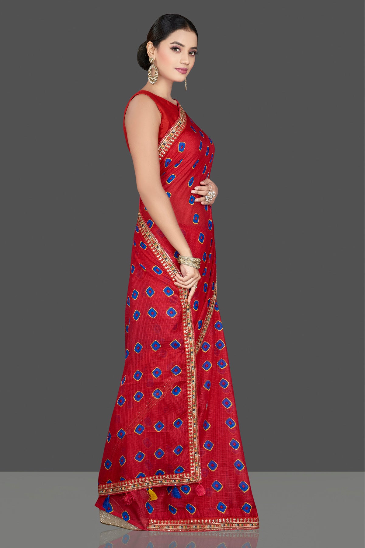Shop stunning red Kota silk saree online in USA with lace border. Be the center of attraction on special occasion in beautiful designer sarees, handloom saris, Kota silk sarees, Banarasi saris, Kanchipuram silk saris from Pure Elegance Indian saree store in USA.-side