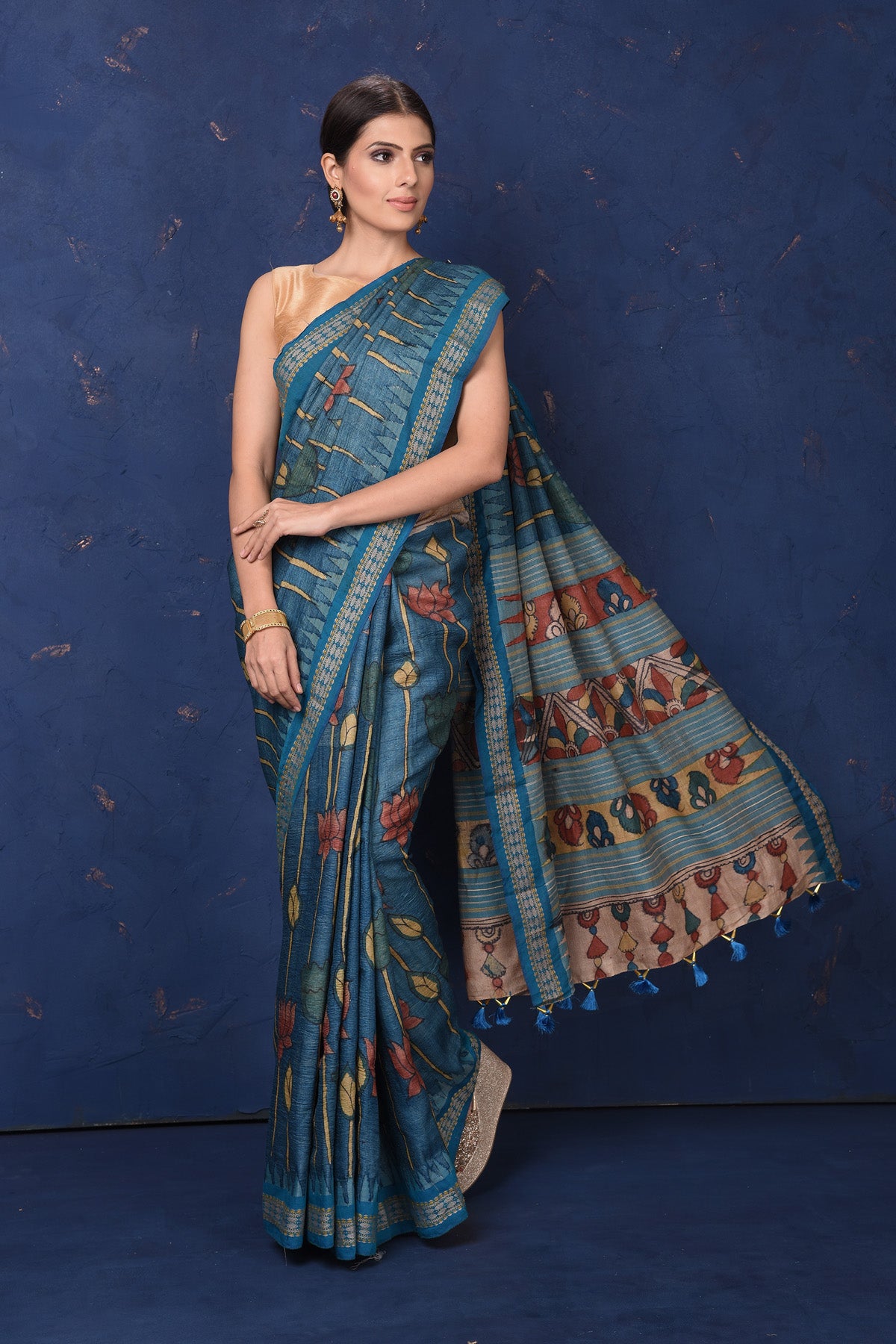 Shop beautiful blue Kalamkari print saree online in USA. Enrich your ethnic wardrobe with traditional Indian sarees, designer sarees. embroidered sarees, pure silk sarees, handwoven sarees, Kanchipuram saris, Banarasi sarees from Pure Elegance Indian saree store in USA.-full view