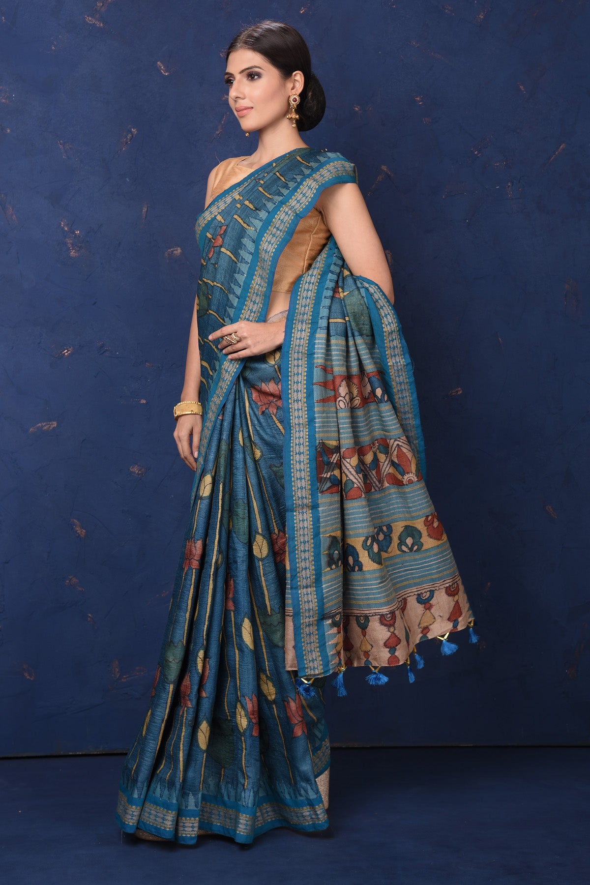 Shop beautiful blue Kalamkari print saree online in USA. Enrich your ethnic wardrobe with traditional Indian sarees, designer sarees. embroidered sarees, pure silk sarees, handwoven sarees, Kanchipuram saris, Banarasi sarees from Pure Elegance Indian saree store in USA.-side