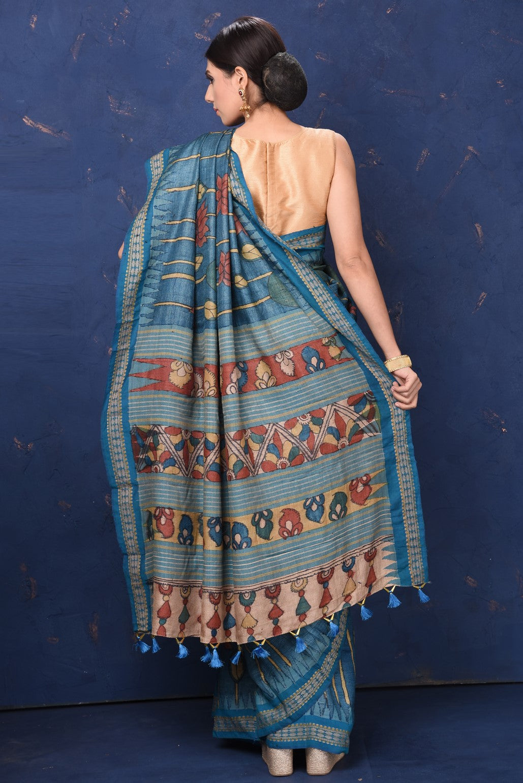 Shop beautiful blue Kalamkari print saree online in USA. Enrich your ethnic wardrobe with traditional Indian sarees, designer sarees. embroidered sarees, pure silk sarees, handwoven sarees, Kanchipuram saris, Banarasi sarees from Pure Elegance Indian saree store in USA.-back
