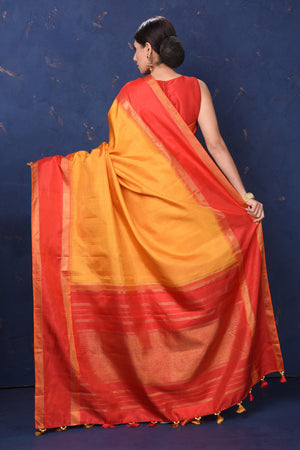 Buy stunning orange Kanjivaram saree online in USA with red zari border and pallu. Enrich your ethnic wardrobe with traditional Indian sarees, designer sarees. embroidered sarees, pure silk sarees, handwoven sarees, Kanchipuram saris, Banarasi sarees from Pure Elegance Indian saree store in USA.-back