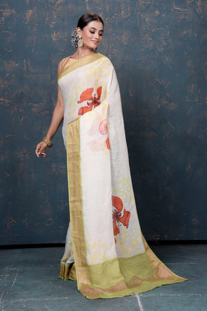 Shop beautiful cream printed linen sari online in USA with green zari border. Enrich your ethnic wardrobe with traditional Indian sarees, designer sarees. embroidered sarees, pure silk sarees, handwoven sarees, Kanchipuram sarees, Banarasi sarees from Pure Elegance Indian saree store in USA.-pallu