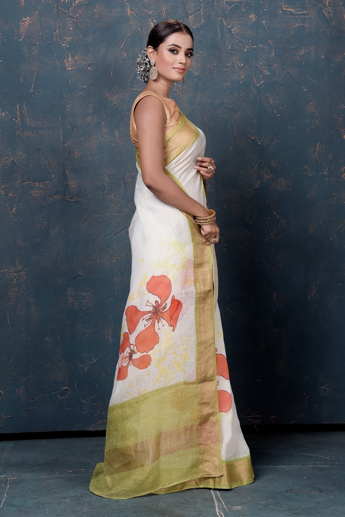 Shop beautiful cream printed linen sari online in USA with green zari border. Enrich your ethnic wardrobe with traditional Indian sarees, designer sarees. embroidered sarees, pure silk sarees, handwoven sarees, Kanchipuram sarees, Banarasi sarees from Pure Elegance Indian saree store in USA.-side