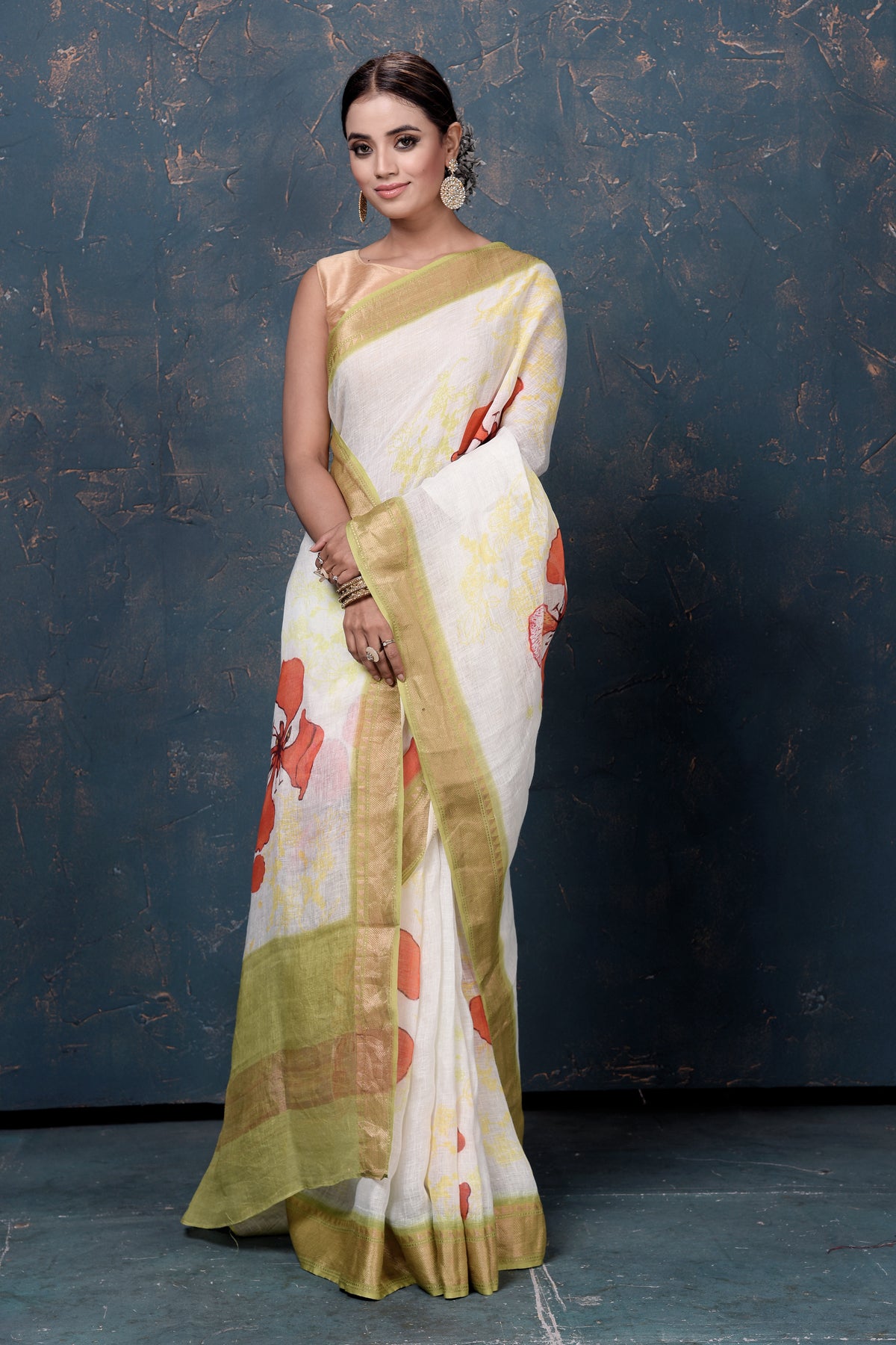 Shop beautiful cream printed linen sari online in USA with green zari border. Enrich your ethnic wardrobe with traditional Indian sarees, designer sarees. embroidered sarees, pure silk sarees, handwoven sarees, Kanchipuram sarees, Banarasi sarees from Pure Elegance Indian saree store in USA.-front