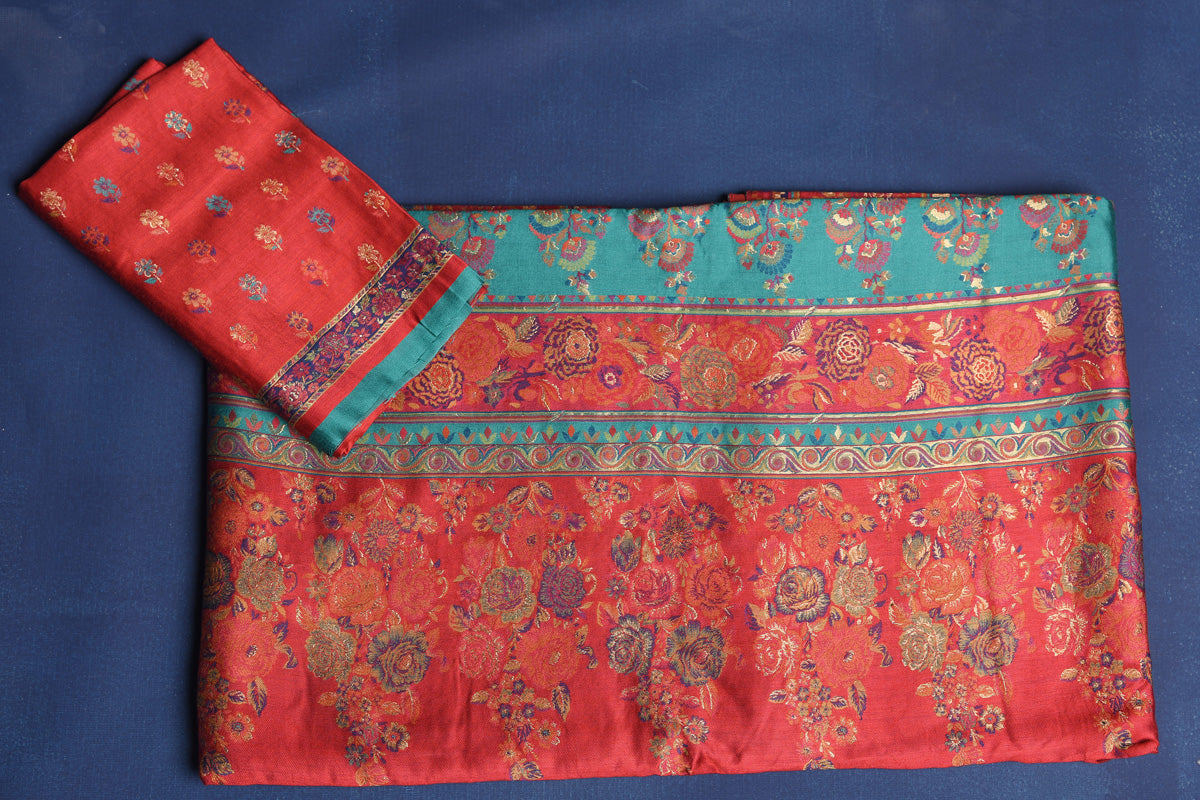 Shop stunning blue Kani weave saree online in USA with red border. Buy latest designer sarees, handloom saris, embroidered sarees, Bollywood sarees, fancy sarees for special occasions from Pure Elegance Indian fashion store in USA. Shop soft silk sarees, pure Banarasi sarees, cotton sarees, georgette sarees. -blouse