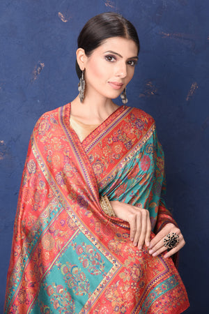 Shop stunning blue Kani weave saree online in USA with red border. Buy latest designer sarees, handloom saris, embroidered sarees, Bollywood sarees, fancy sarees for special occasions from Pure Elegance Indian fashion store in USA. Shop soft silk sarees, pure Banarasi sarees, cotton sarees, georgette sarees. -closeup