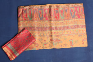 Shop stunning yellow Kani weave tussar muga silk saree online in USA. Buy latest designer sarees, handloom saris, embroidered sarees, Bollywood sarees, fancy sarees for special occasions from Pure Elegance Indian fashion store in USA. Shop soft silk sarees, pure Banarasi sarees, cotton sarees, georgette sarees. -blouse