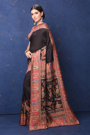 Shop stunning black tussar muga silk saree online in USA with Kani border. Buy latest designer sarees, handloom saris, embroidered sarees, Bollywood sarees, fancy sarees for special occasions from Pure Elegance Indian fashion store in USA. Shop soft silk sarees, pure Banarasi sarees, cotton sarees, georgette sarees. -pallu