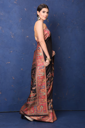 Shop stunning black tussar muga silk saree online in USA with Kani border. Buy latest designer sarees, handloom saris, embroidered sarees, Bollywood sarees, fancy sarees for special occasions from Pure Elegance Indian fashion store in USA. Shop soft silk sarees, pure Banarasi sarees, cotton sarees, georgette sarees. -side