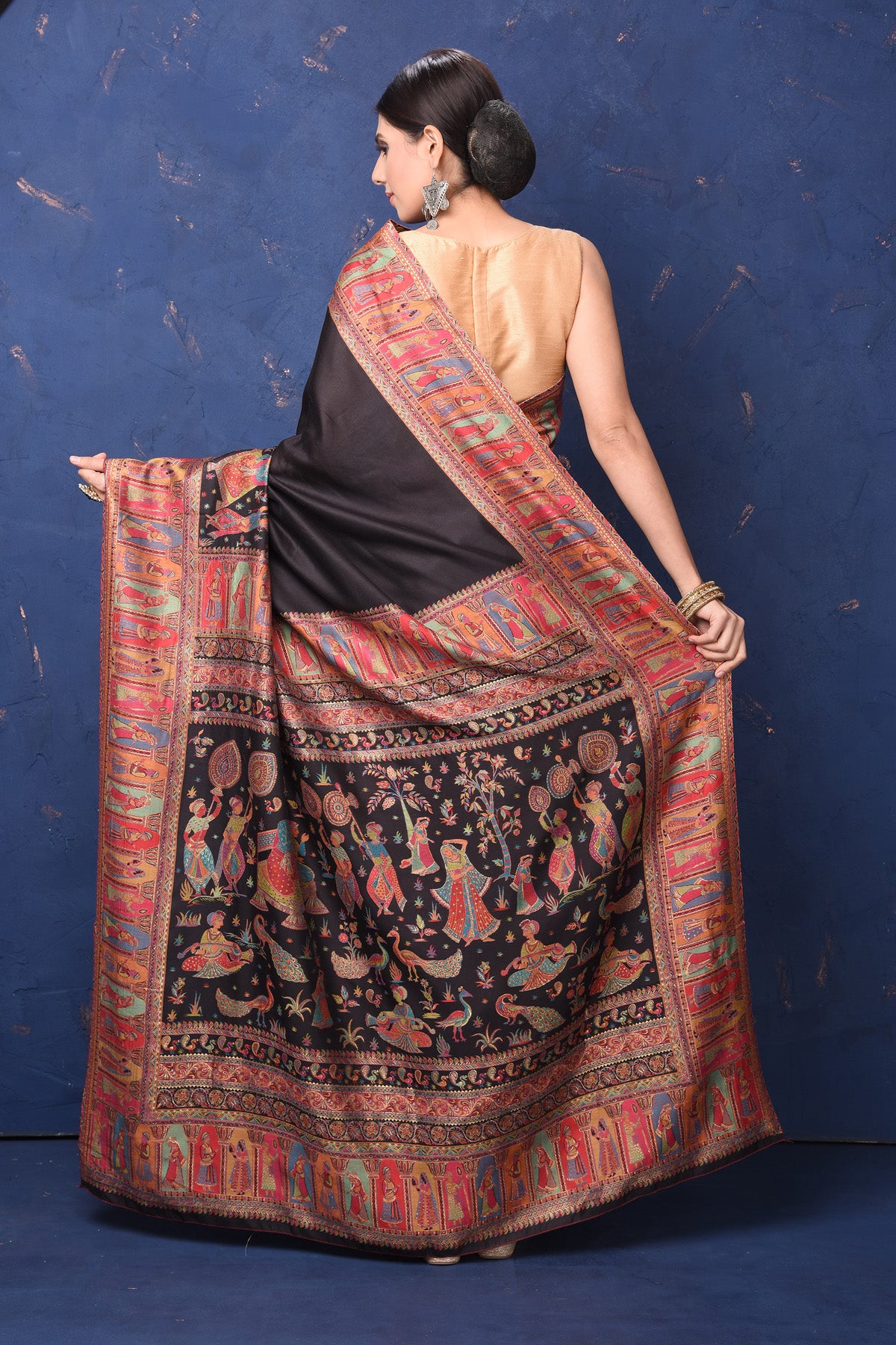 Shop stunning black tussar muga silk saree online in USA with Kani border. Buy latest designer sarees, handloom saris, embroidered sarees, Bollywood sarees, fancy sarees for special occasions from Pure Elegance Indian fashion store in USA. Shop soft silk sarees, pure Banarasi sarees, cotton sarees, georgette sarees. -back