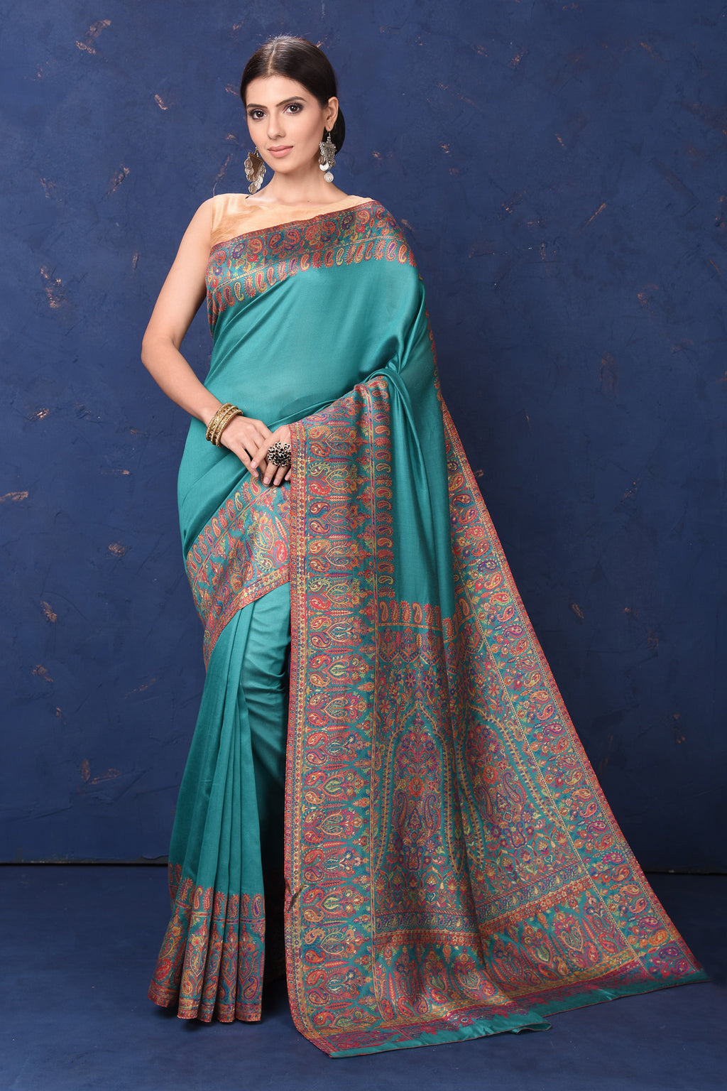 Shop stunning blue tussar muga silk sari online in USA with Kani border. Buy latest designer sarees, handloom saris, embroidered sarees, Bollywood sarees, fancy sarees for special occasions from Pure Elegance Indian fashion store in USA. Shop soft silk sarees, pure Banarasi sarees, cotton sarees, georgette sarees. -full view