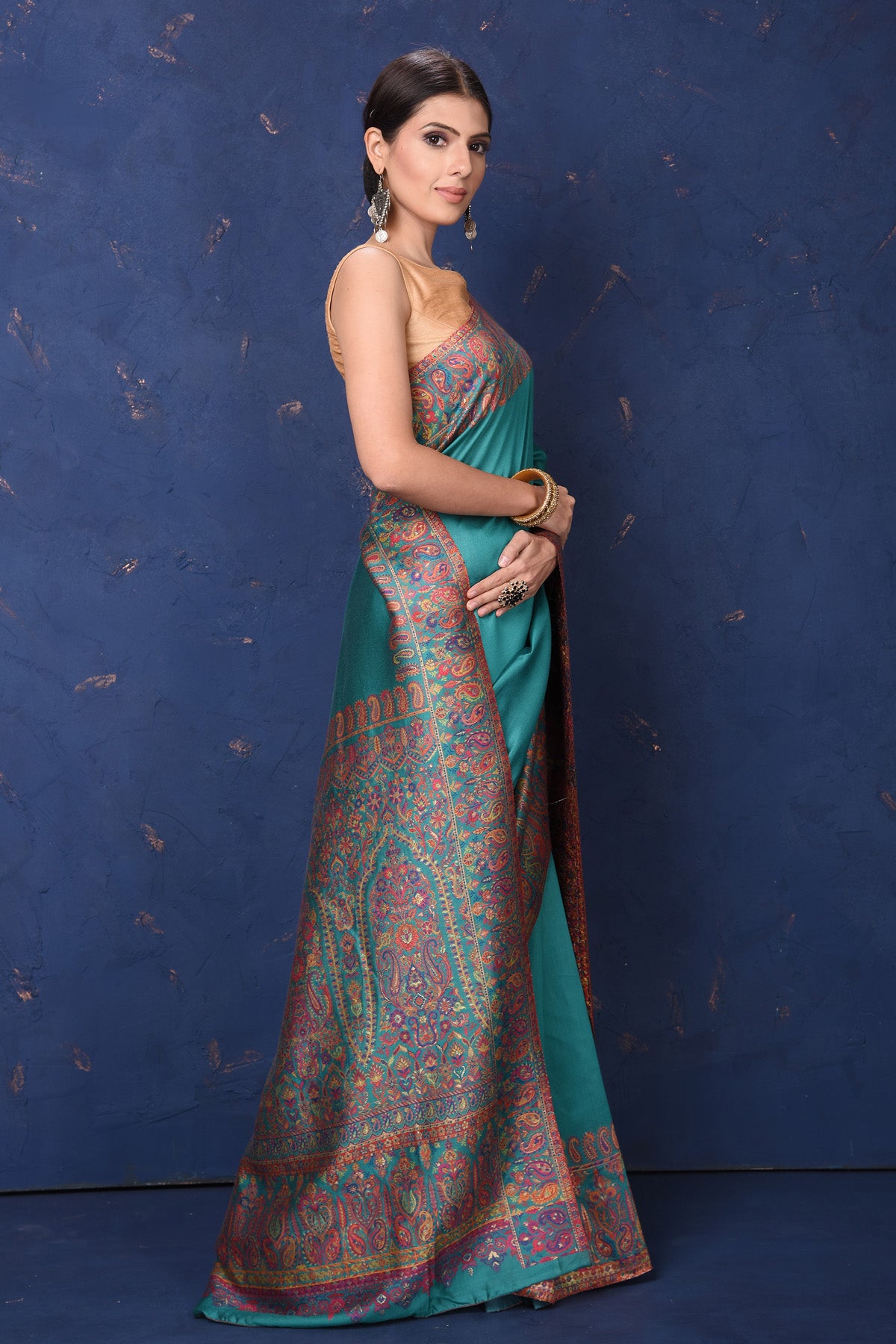 Shop stunning blue tussar muga silk sari online in USA with Kani border. Buy latest designer sarees, handloom saris, embroidered sarees, Bollywood sarees, fancy sarees for special occasions from Pure Elegance Indian fashion store in USA. Shop soft silk sarees, pure Banarasi sarees, cotton sarees, georgette sarees. -right