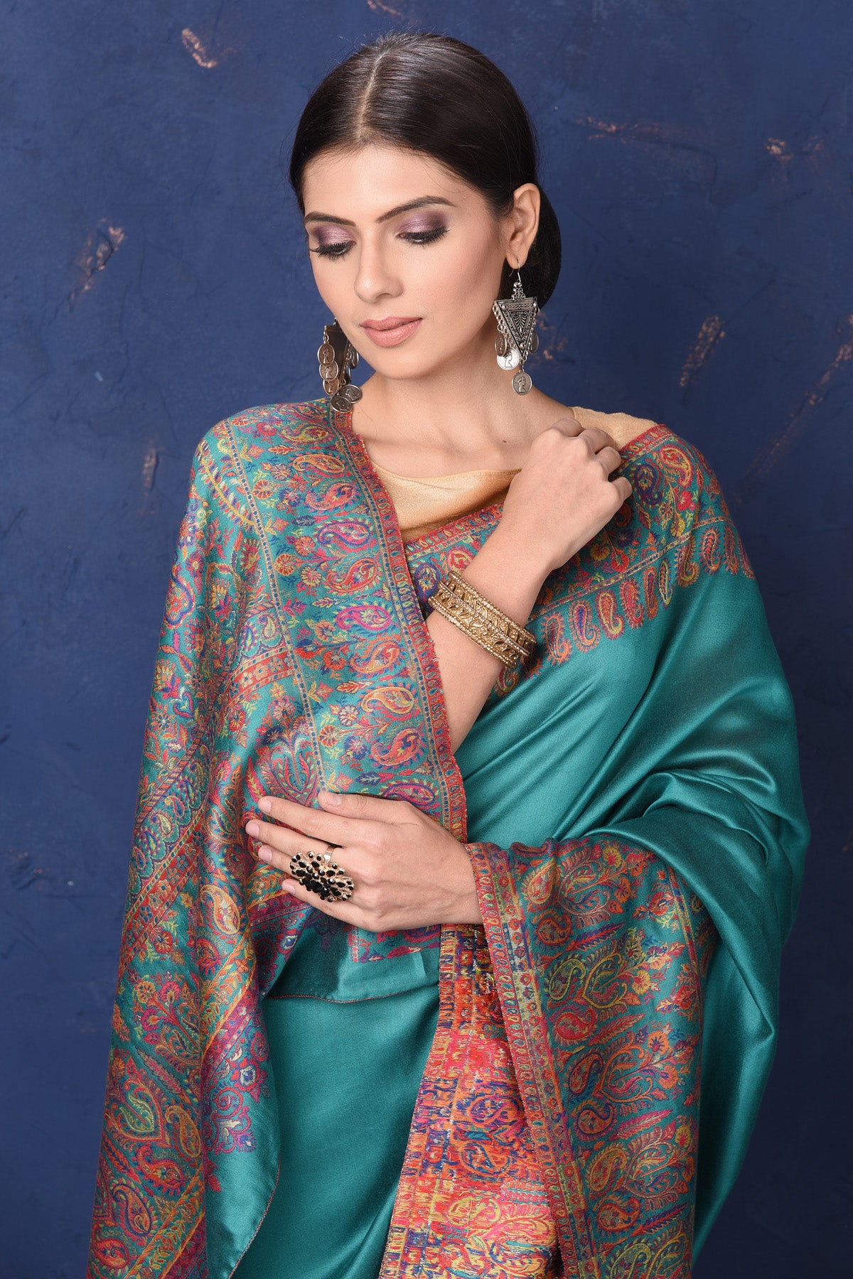 Shop stunning blue tussar muga silk sari online in USA with Kani border. Buy latest designer sarees, handloom saris, embroidered sarees, Bollywood sarees, fancy sarees for special occasions from Pure Elegance Indian fashion store in USA. Shop soft silk sarees, pure Banarasi sarees, cotton sarees, georgette sarees. -closeup