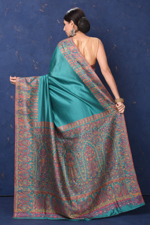 Shop stunning blue tussar muga silk sari online in USA with Kani border. Buy latest designer sarees, handloom saris, embroidered sarees, Bollywood sarees, fancy sarees for special occasions from Pure Elegance Indian fashion store in USA. Shop soft silk sarees, pure Banarasi sarees, cotton sarees, georgette sarees. -back