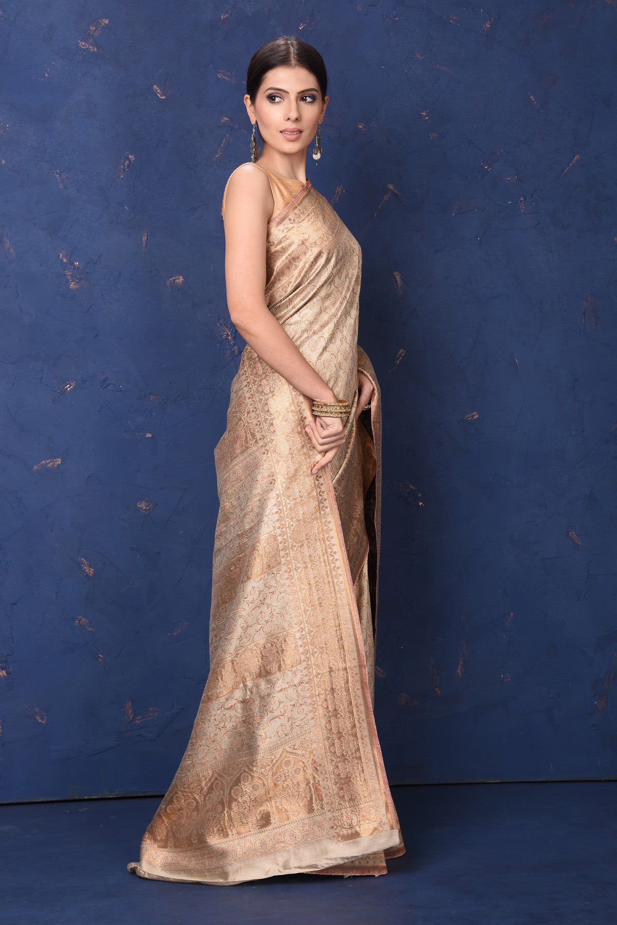 Shop beautiful cream handspun silk sari online in USA. Buy latest designer sarees, handloom saris, embroidered sarees, Bollywood sarees, fancy sarees for special occasions from Pure Elegance Indian fashion store in USA. Shop soft silk sarees, pure Banarasi sarees, cotton sarees, georgette sarees.-side