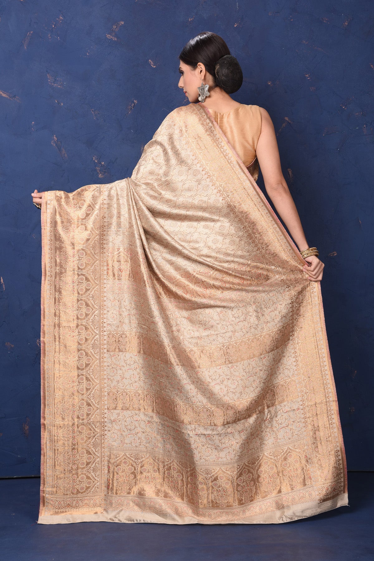 Shop beautiful cream handspun silk sari online in USA. Buy latest designer sarees, handloom saris, embroidered sarees, Bollywood sarees, fancy sarees for special occasions from Pure Elegance Indian fashion store in USA. Shop soft silk sarees, pure Banarasi sarees, cotton sarees, georgette sarees.-back
