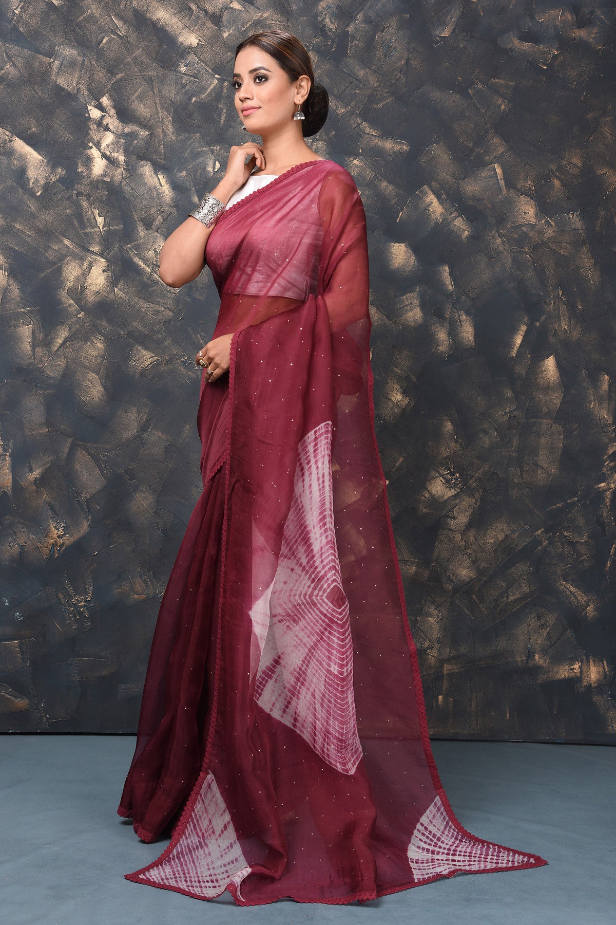 Shop beautiful maroon Bandhej organza sari online in USA. Enrich your ethnic wardrobe with traditional Indian sarees, designer sarees. embroidered sarees, pure silk sarees, handwoven sarees, Kanchipuram sarees, Banarasi saris from Pure Elegance Indian saree store in USA.-pallu