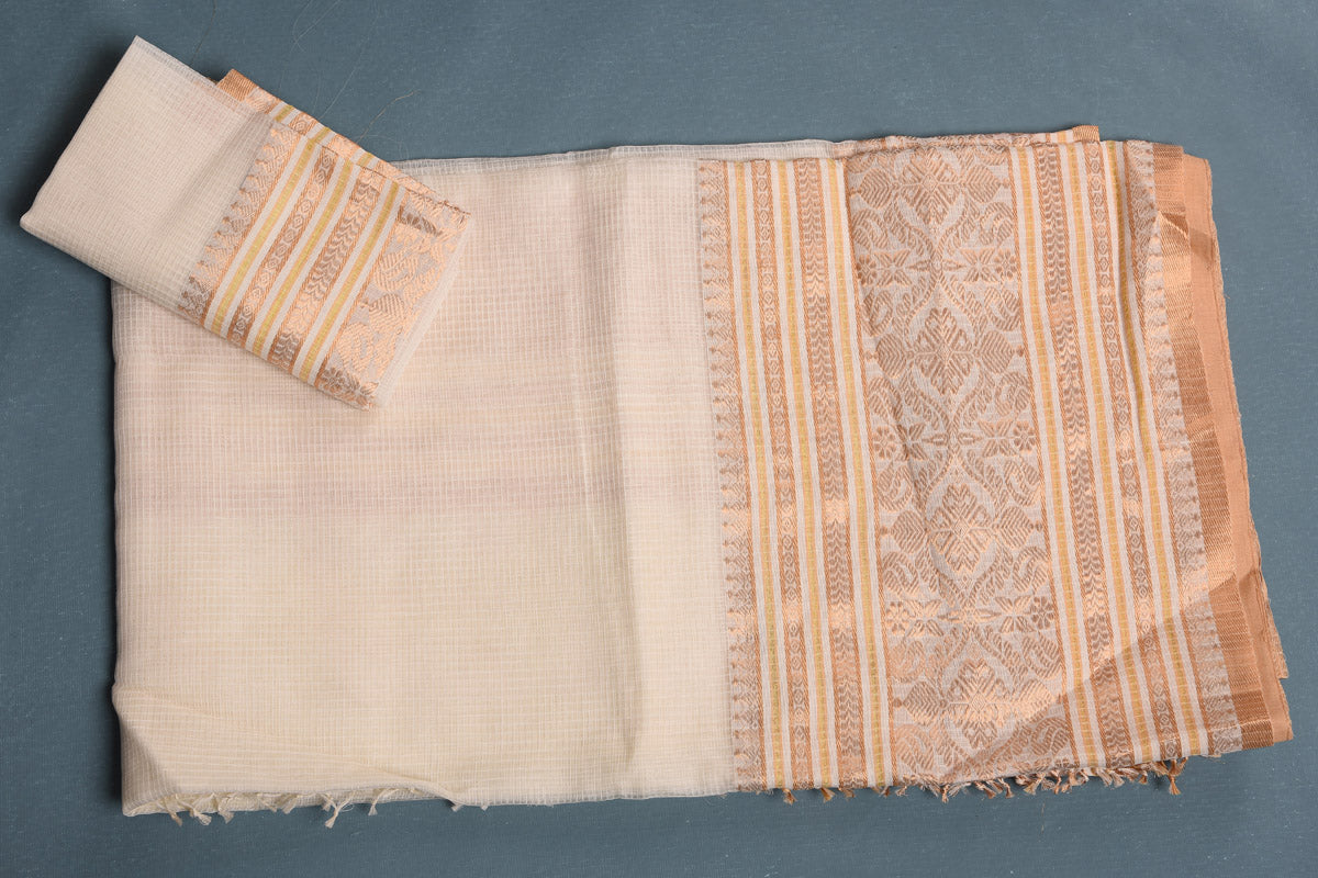Shop stunning cream tangail silk saree online in USA with golden resham work border. Enrich your ethnic wardrobe with traditional Indian sarees, designer sarees. embroidered sarees, pure silk sarees, handwoven sarees, Kanchipuram sarees, Banarasi saris from Pure Elegance Indian saree store in USA.-blouse