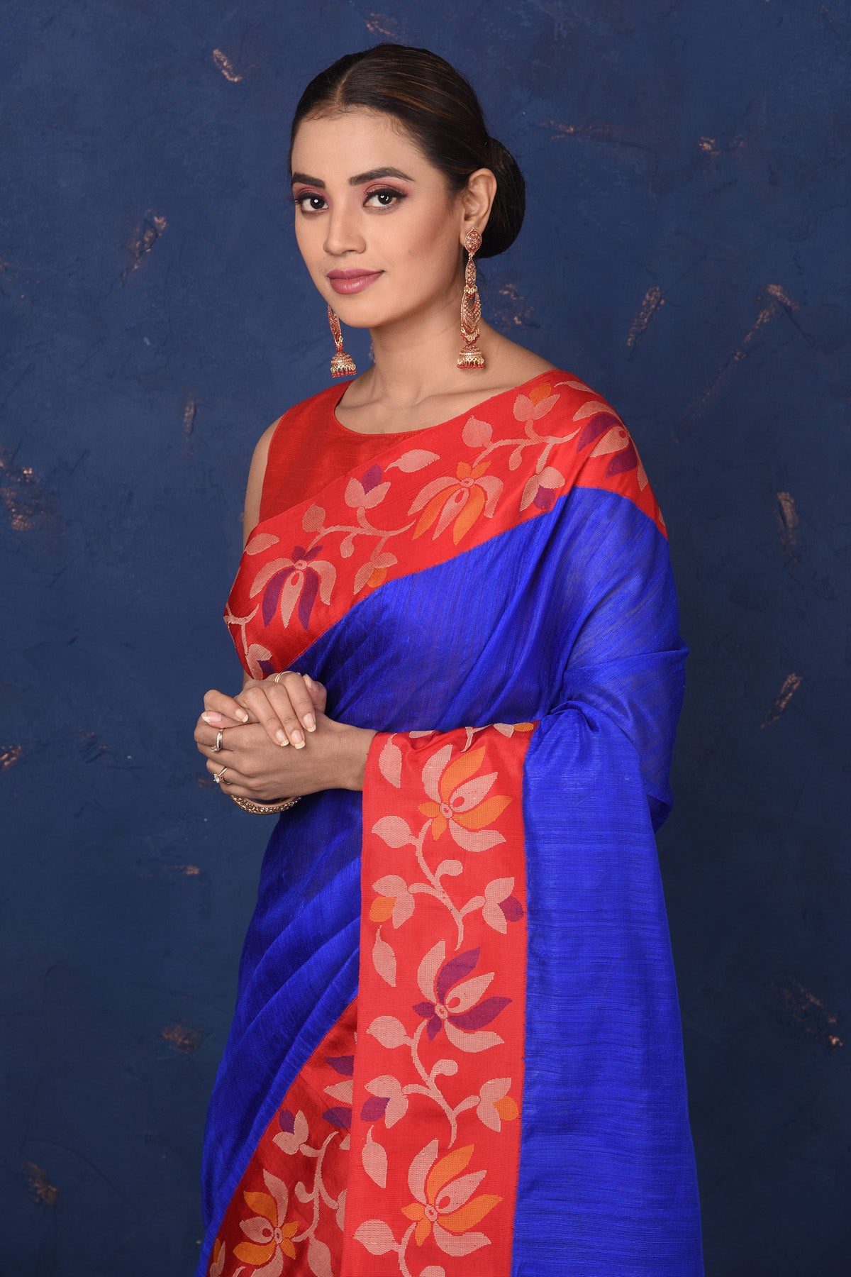 Shop beautiful bright blue matka silk saree online in USA with red cut shuttle weave border. Look elegant on festive occasions in exclusive silk sarees, matka sarees, handwoven sarees, embroidered sarees, designer sarees from Pure Elegance Indian saree store in USA.-closeup
