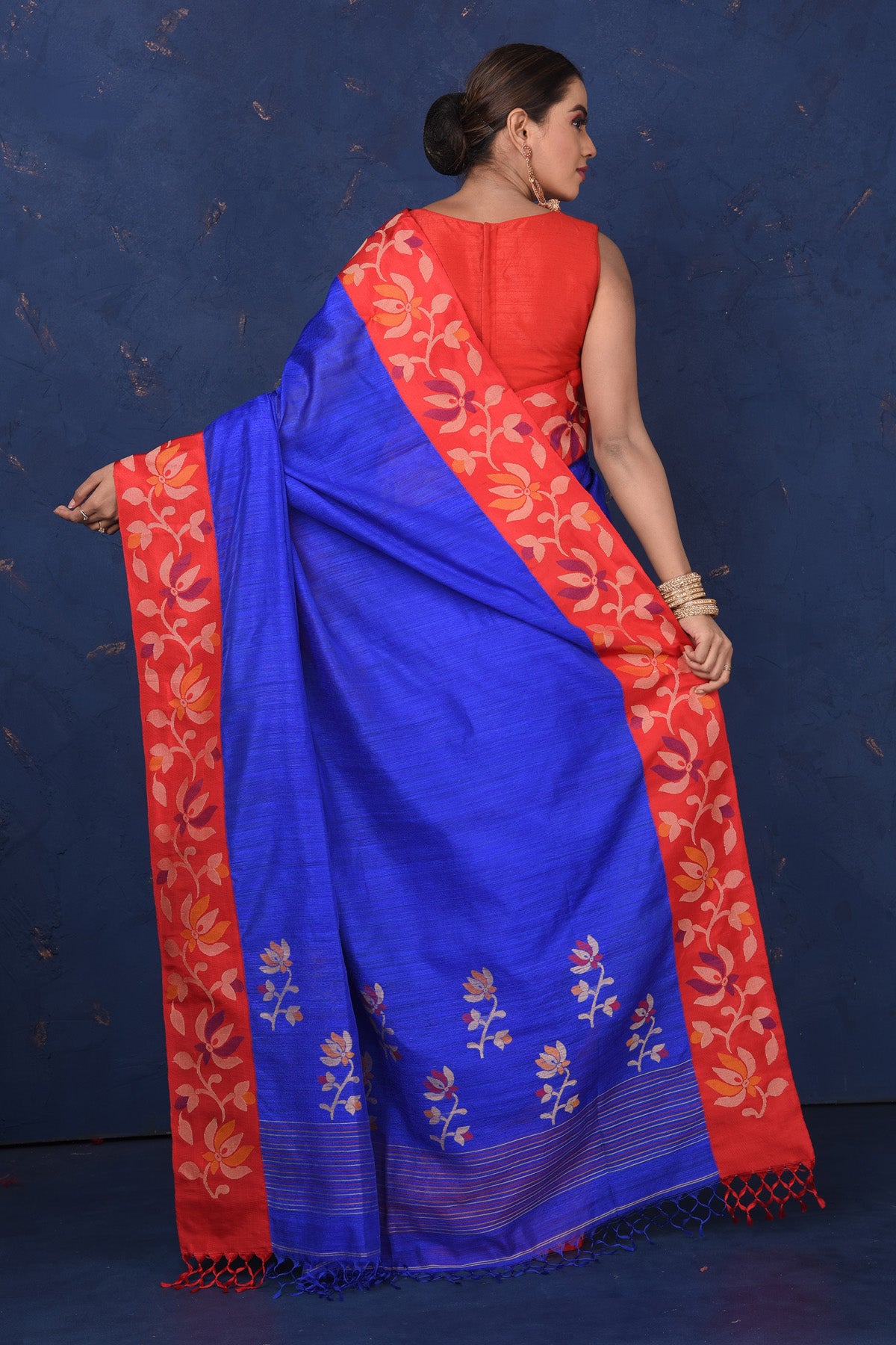Shop beautiful bright blue matka silk saree online in USA with red cut shuttle weave border. Look elegant on festive occasions in exclusive silk sarees, matka sarees, handwoven sarees, embroidered sarees, designer sarees from Pure Elegance Indian saree store in USA.-back