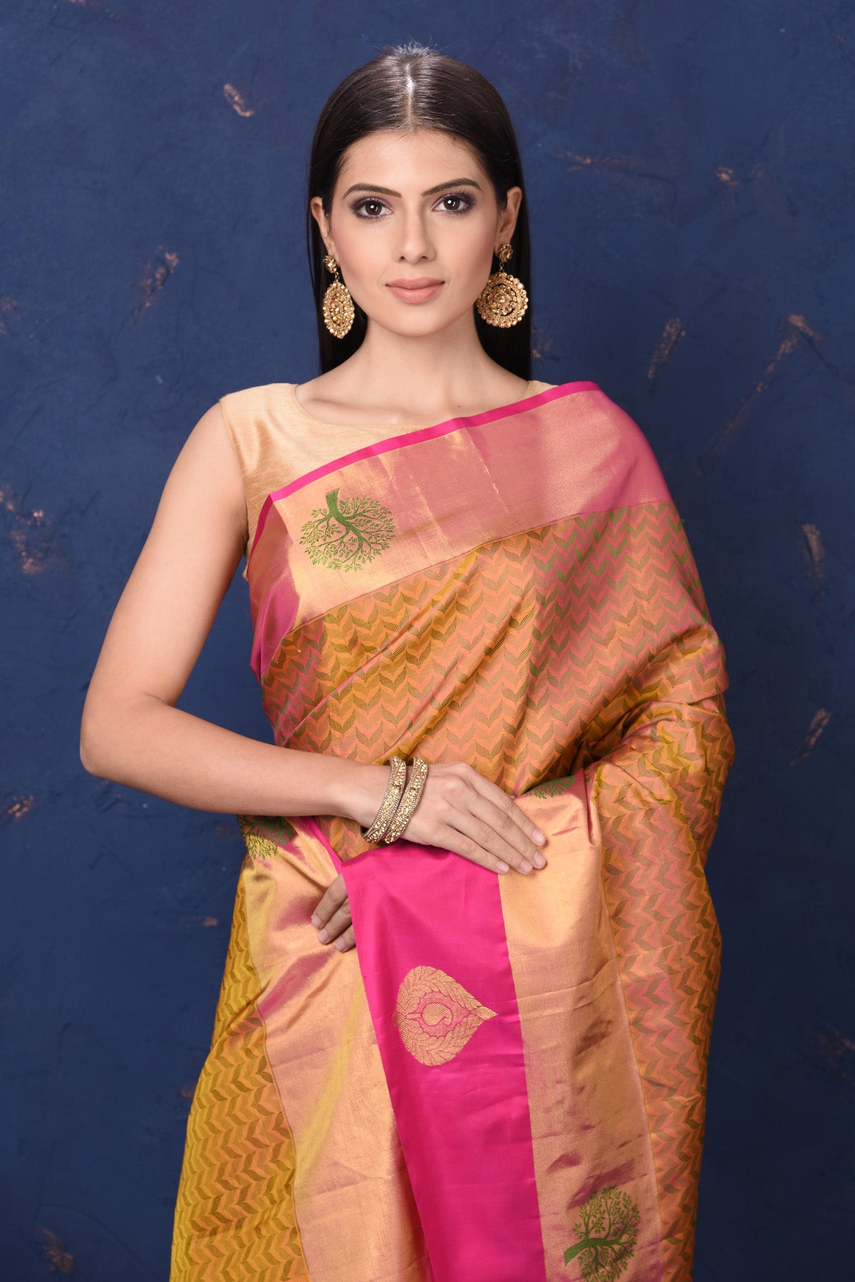 Buy beautiful mustard Kanjivaram silk sari online in USA with pink zari border. Flaunt your ethnic style at weddings and festive occasions in exquisite Indian sarees, Kanjeevaram sarees, handloom sarees, designer sarees, embroidered sarees from Pure Elegance Indian saree store in USA.-closeup