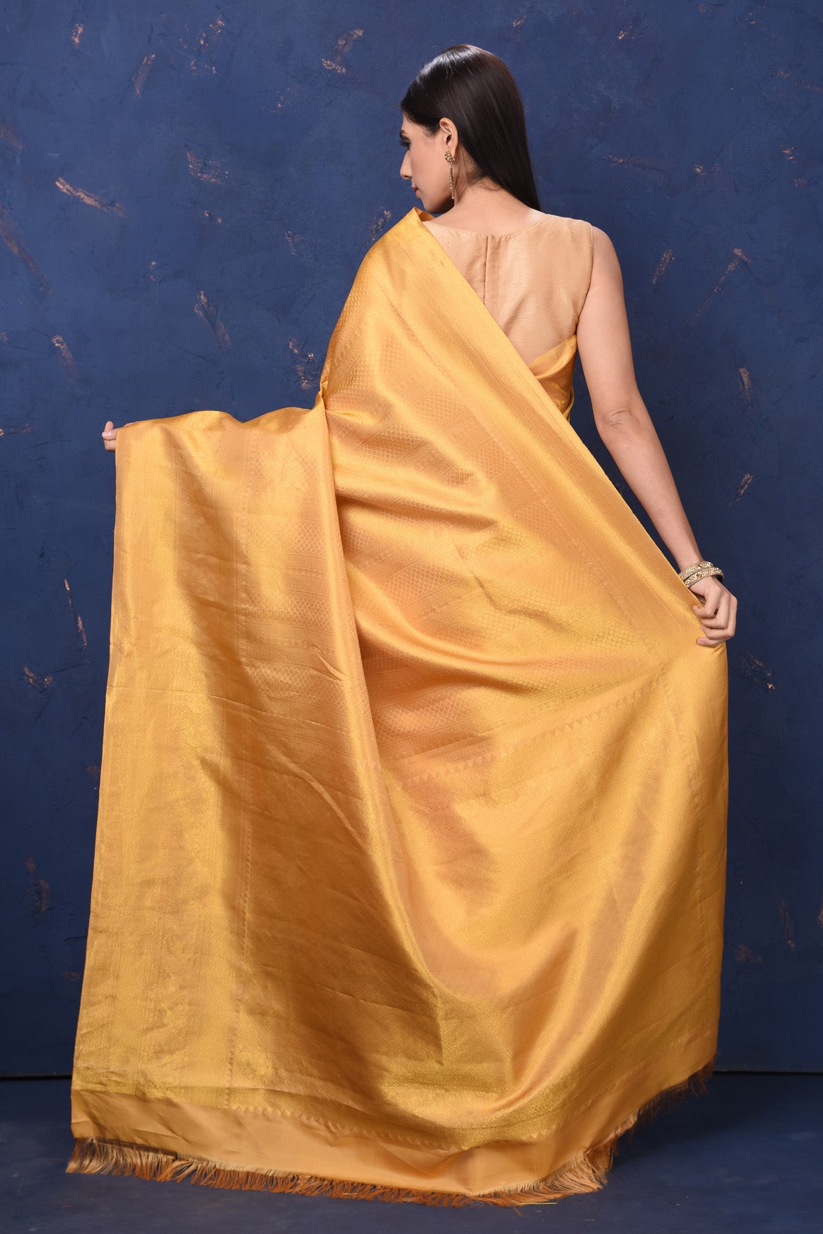 Buy stunning beige golden Kanjivaram silk sari online in USA. Flaunt your ethnic style at weddings and festive occasions in exquisite Indian sarees, Kanjeevaram sarees, handloom sarees, designer sarees, embroidered sarees from Pure Elegance Indian saree store in USA.-back