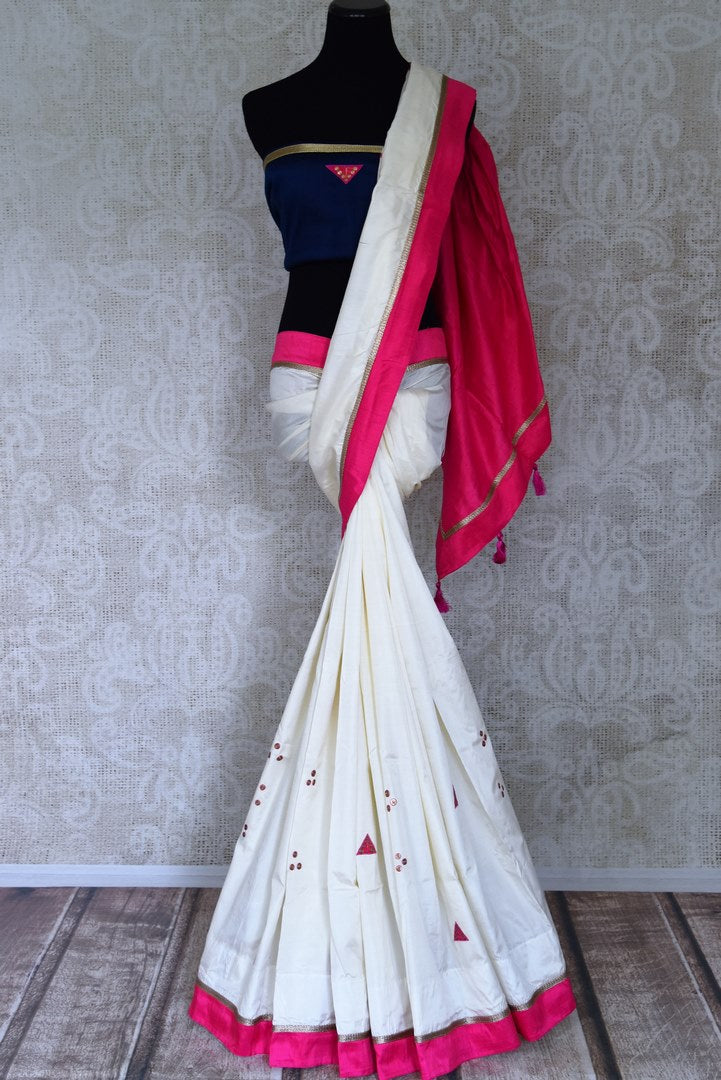 Shop gorgeous off-white applique Sonamukhi silk saree online in USA with pink raw silk border. Buy exclusive Indian designers sarees, organza saris, embroidered sarees, handwoven saris, sarees with blouses in USA available at Pure Elegance Indian fashion store.-full view
