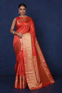 Buy stunning red Kanjeevaram sari online in USA with golden zari buta and zari border. Be the center of attraction on special occasions in stunning designer sarees, handloom sarees, Kanchipuram silk sarees, pure silk sarees from Pure Elegance Indian fashion store in USA.-full view