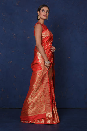 Buy stunning red Kanjeevaram sari online in USA with golden zari buta and zari border. Be the center of attraction on special occasions in stunning designer sarees, handloom sarees, Kanchipuram silk sarees, pure silk sarees from Pure Elegance Indian fashion store in USA.-side