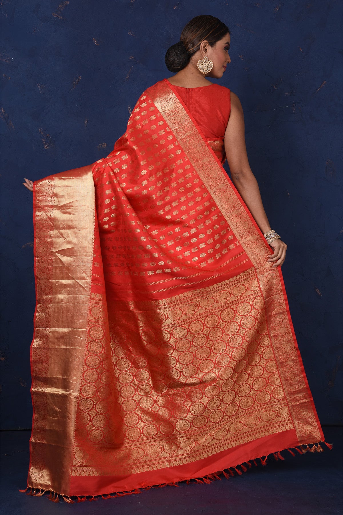 Buy stunning red Kanjeevaram sari online in USA with golden zari buta and zari border. Be the center of attraction on special occasions in stunning designer sarees, handloom sarees, Kanchipuram silk sarees, pure silk sarees from Pure Elegance Indian fashion store in USA.-back
