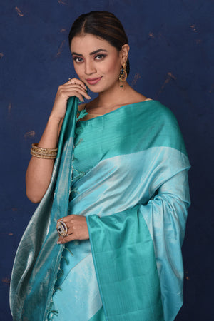 Shop stunning blue Kanjeevaram silk sari online in USA with green zari border. Be the center of attraction on special occasions in stunning designer sarees, handloom sarees, Kanchipuram silk sarees, pure silk sarees from Pure Elegance Indian fashion store in USA..-closeup