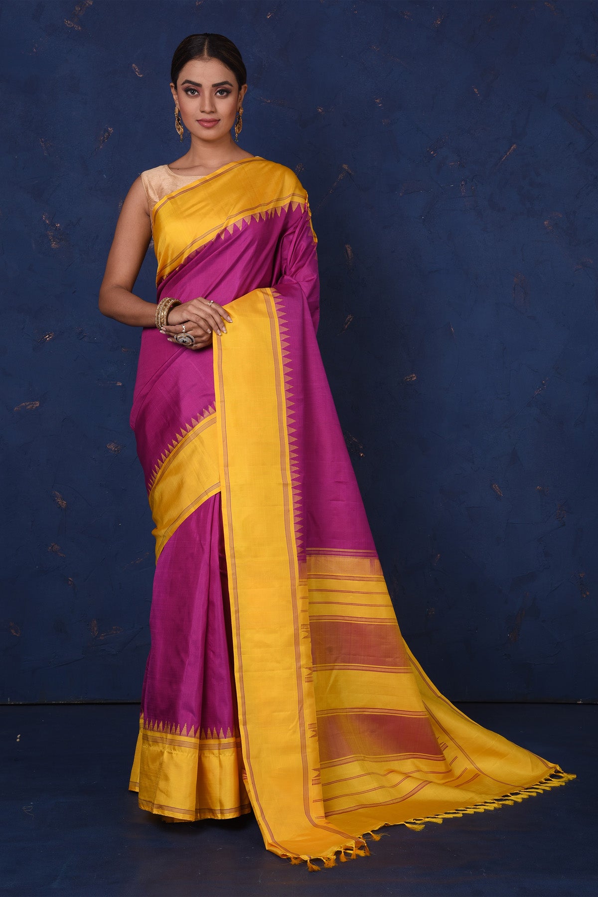 Shop beautiful purple Kanjeevaram silk saree online in USA with yellow border and pallu. Be the center of attraction on special occasions in stunning designer sarees, handloom sarees, Kanchipuram silk sarees, pure silk sarees from Pure Elegance Indian fashion store in USA.-full view