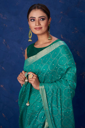Buy stunning sea green badla work saree online in USA with golden border. Keep your ethnic wardrobe with exclusive designer sarees, handloom sarees, pure silk sarees, soft silk sarees, Banarasi silk sarees from Pure Elegance Indian fashion store in USA.-closeup