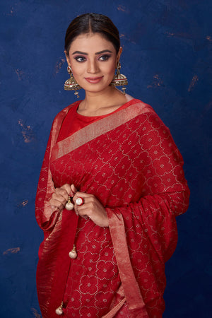 Shop beautiful dark red badla work saree online in USA with golden border. Keep your ethnic wardrobe with exclusive designer sarees, handloom sarees, pure silk sarees, soft silk sarees, Banarasi silk sarees from Pure Elegance Indian fashion store in USA.-closeup