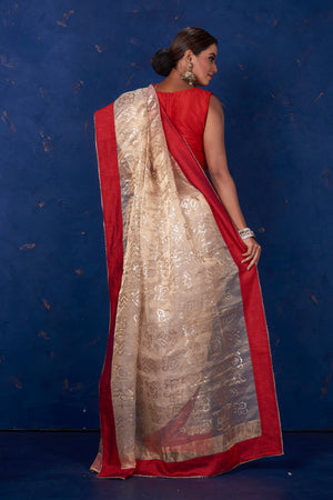 Shop stunning beige foil print organza sari online in USA with red border. Keep your ethnic wardrobe with exclusive designer sarees, handloom sarees, pure silk sarees, soft silk sarees, Banarasi silk sarees from Pure Elegance Indian fashion store in USA.-back