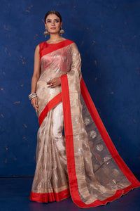 Buy gorgeous beige foil print organza saree online in USA with solid red border. Keep your ethnic wardrobe with exclusive designer sarees, handloom sarees, pure silk sarees, soft silk sarees, Banarasi silk sarees from Pure Elegance Indian fashion store in USA.-full view