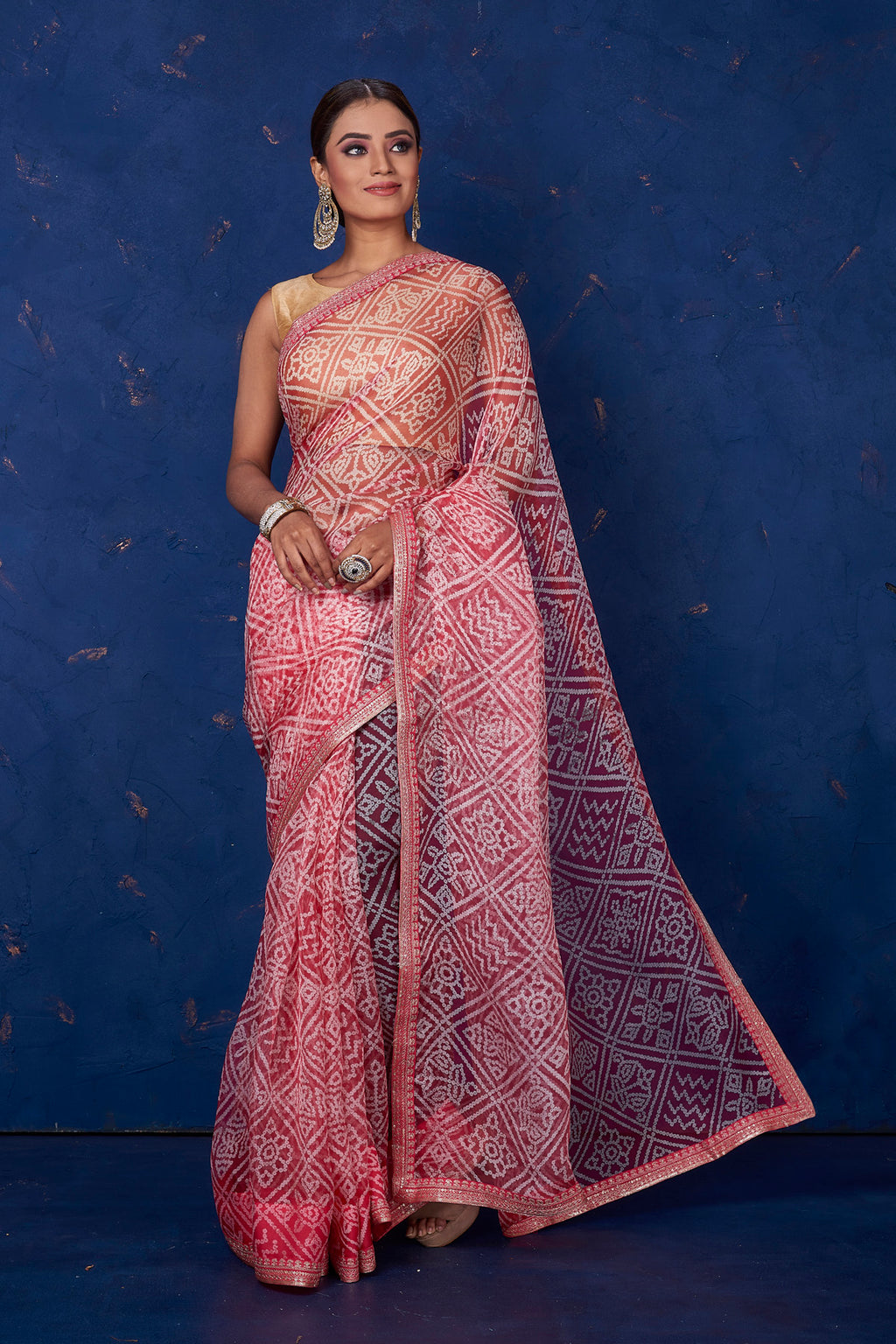 Shop gorgeous red organza Bandhej print sari online in USA. Keep your ethnic wardrobe with exclusive designer sarees, handloom sarees, pure silk sarees, soft silk sarees, Banarasi silk sarees from Pure Elegance Indian fashion store in USA.-full view