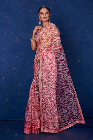 Shop gorgeous red organza Bandhej print sari online in USA. Keep your ethnic wardrobe with exclusive designer sarees, handloom sarees, pure silk sarees, soft silk sarees, Banarasi silk sarees from Pure Elegance Indian fashion store in USA.-pallu