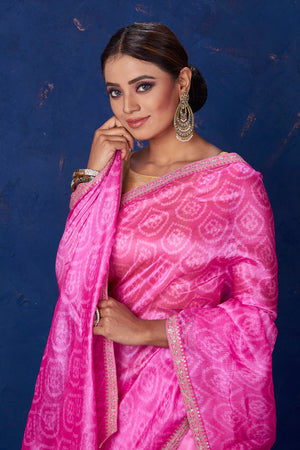 Shop gorgeous light pink embroidered Bandhej organza saree online in USA. Keep your ethnic wardrobe with exclusive designer sarees, handloom sarees, pure silk sarees, soft silk sarees, Banarasi silk sarees from Pure Elegance Indian fashion store in USA.-closeup