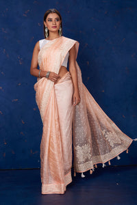 Shop stunning peach Kota tussar saree online in USA with embroidery. Keep your ethnic wardrobe up to date with latest designer sarees, pure silk sarees, handwoven sarees, tussar silk sarees, embroidered sarees from Pure Elegance Indian saree store in USA.-full view