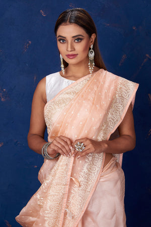 Shop stunning peach Kota tussar saree online in USA with embroidery. Keep your ethnic wardrobe up to date with latest designer sarees, pure silk sarees, handwoven sarees, tussar silk sarees, embroidered sarees from Pure Elegance Indian saree store in USA.-closeup