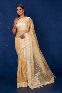 Shop stunning light yellow Kota tussar saree online in USA with embroidery. Keep your ethnic wardrobe up to date with latest designer sarees, pure silk sarees, handwoven sarees, tussar silk sarees, embroidered sarees from Pure Elegance Indian saree store in USA.-full view