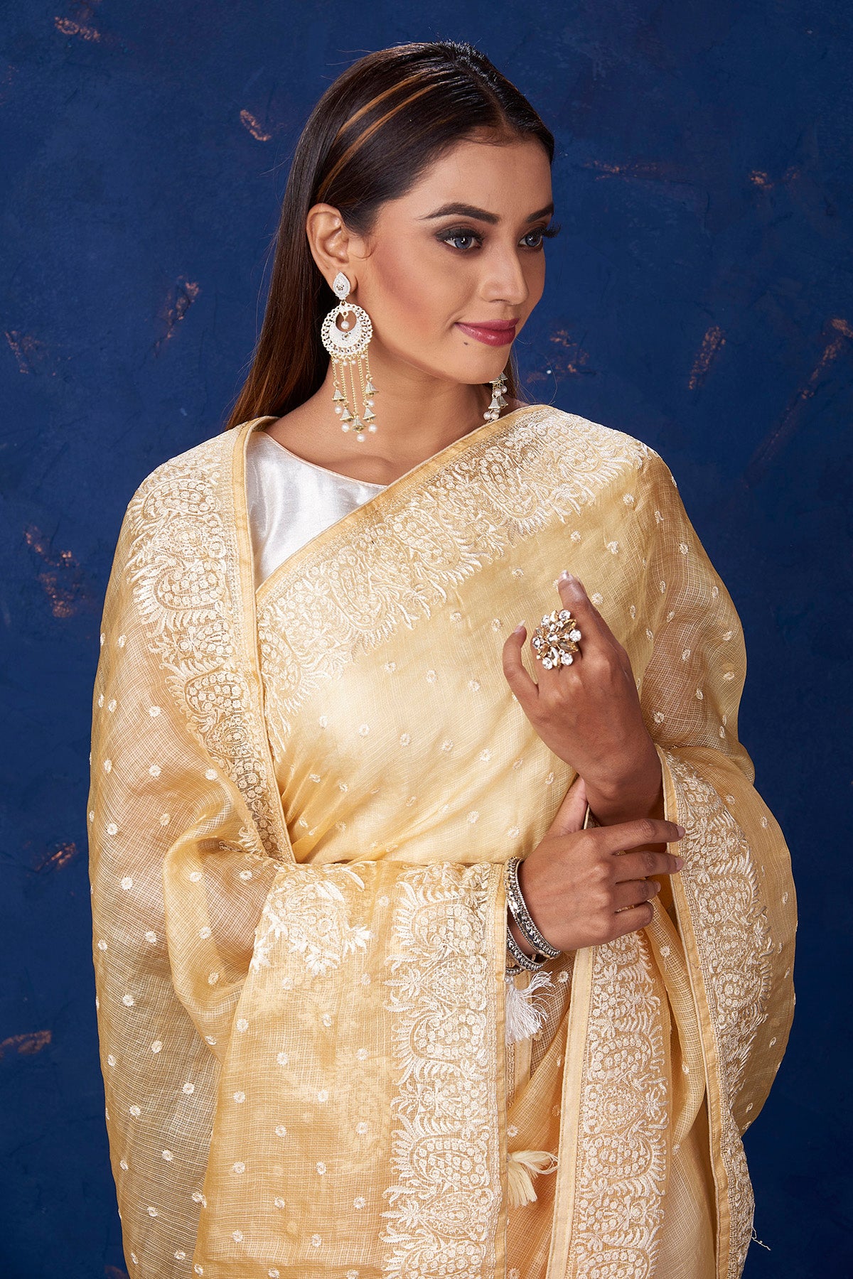 Shop stunning light yellow Kota tussar saree online in USA with embroidery. Keep your ethnic wardrobe up to date with latest designer sarees, pure silk sarees, handwoven sarees, tussar silk sarees, embroidered sarees from Pure Elegance Indian saree store in USA.-closeup