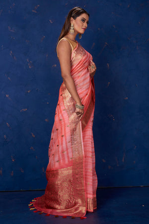 Buy beautiful light pink striped Kora Banarasi saree online in USA with zari border. Keep your ethnic wardrobe up to date with latest designer sarees, pure silk sarees, handwoven sarees, tussar silk sarees, embroidered sarees from Pure Elegance Indian saree store in USA.-side