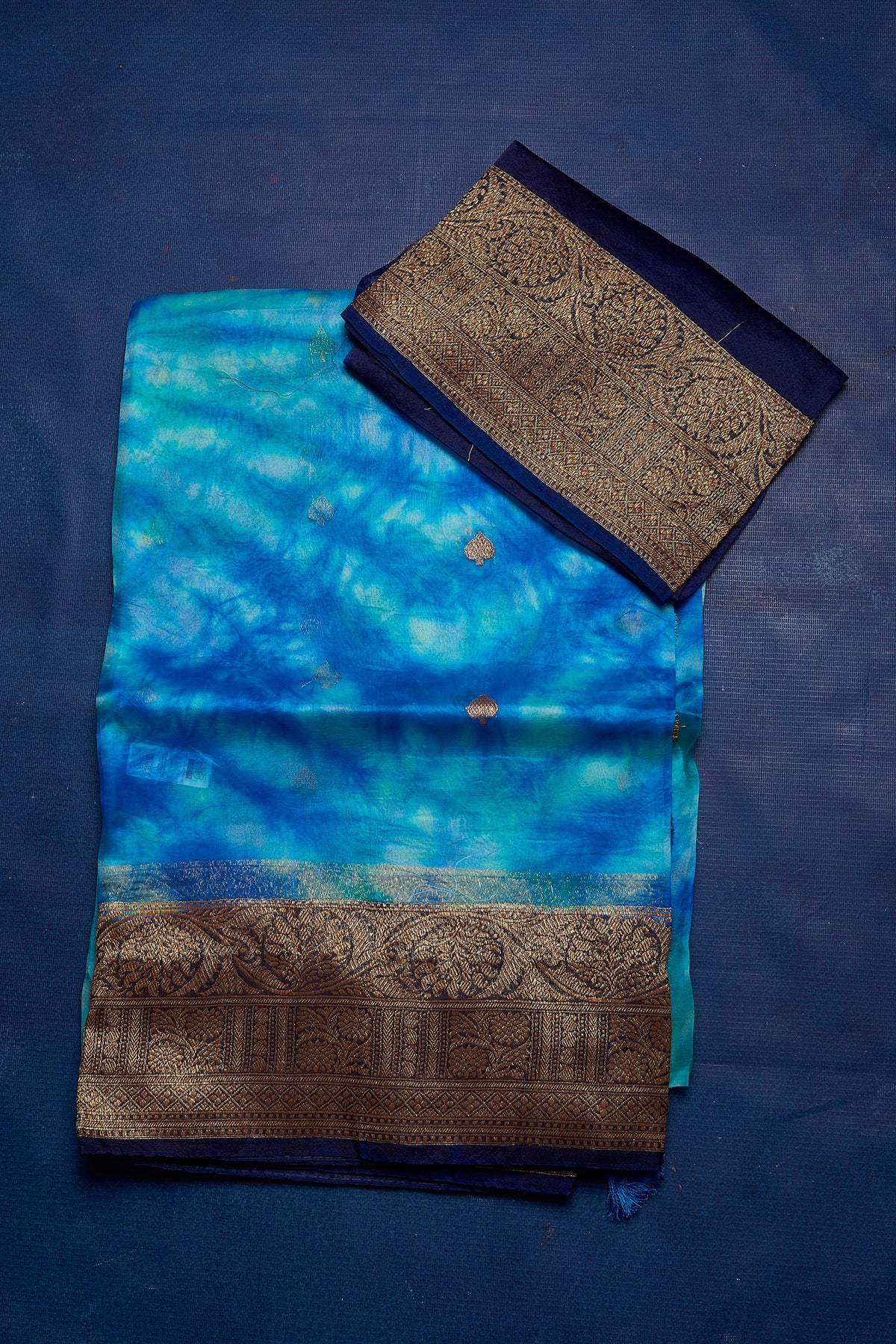 Buy beautiful blue Kora Banarasi saree online in USA with zari border. Keep your ethnic wardrobe up to date with latest designer sarees, pure silk sarees, handwoven sarees, tussar silk sarees, embroidered sarees from Pure Elegance Indian saree store in USA.-blouse