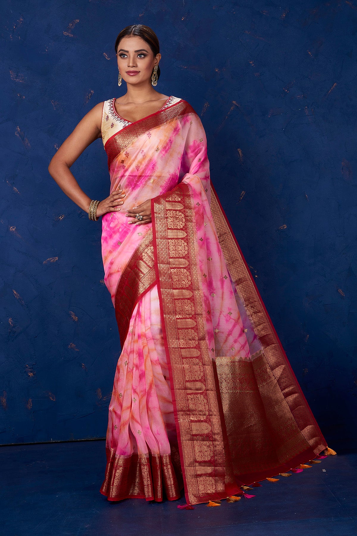 Buy beautiful pink tie and dye Kora Banarasi saree online in USA with red zari border. Keep your ethnic wardrobe up to date with latest designer sarees, pure silk sarees, handwoven sarees, tussar silk sarees, embroidered sarees from Pure Elegance Indian saree store in USA.-full view
