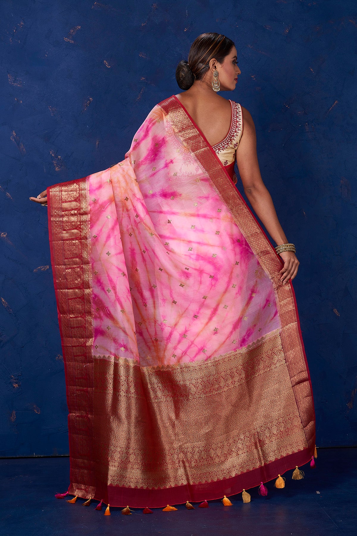 Buy beautiful pink tie and dye Kora Banarasi saree online in USA with red zari border. Keep your ethnic wardrobe up to date with latest designer sarees, pure silk sarees, handwoven sarees, tussar silk sarees, embroidered sarees from Pure Elegance Indian saree store in USA.-back