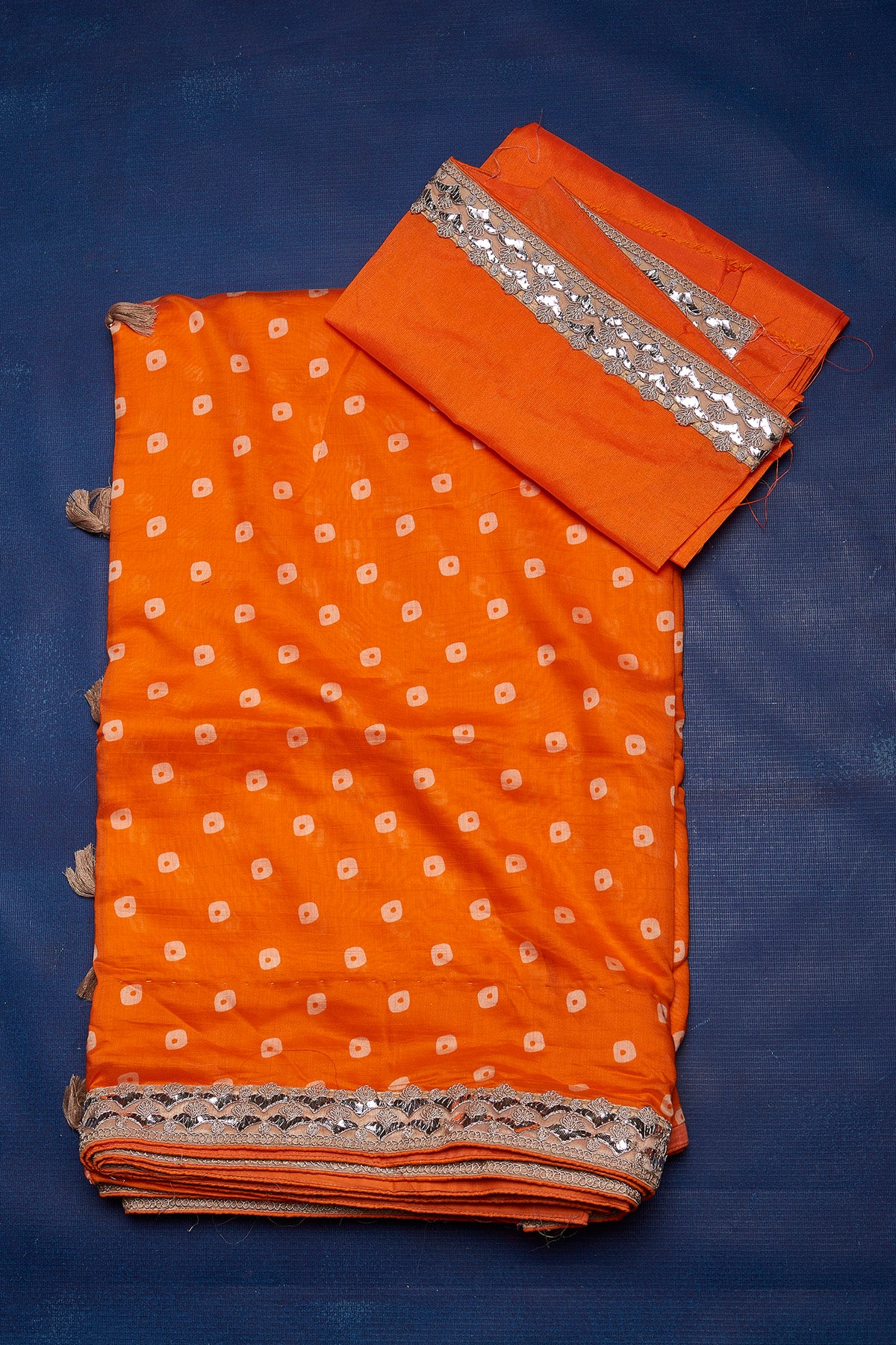 Buy beautiful orange bandhej chanderi saree online in USA with embroidered border. Keep your ethnic wardrobe up to date with latest designer sarees, pure silk sarees, handwoven sarees, tussar silk sarees, embroidered sarees from Pure Elegance Indian saree store in USA.-blouse